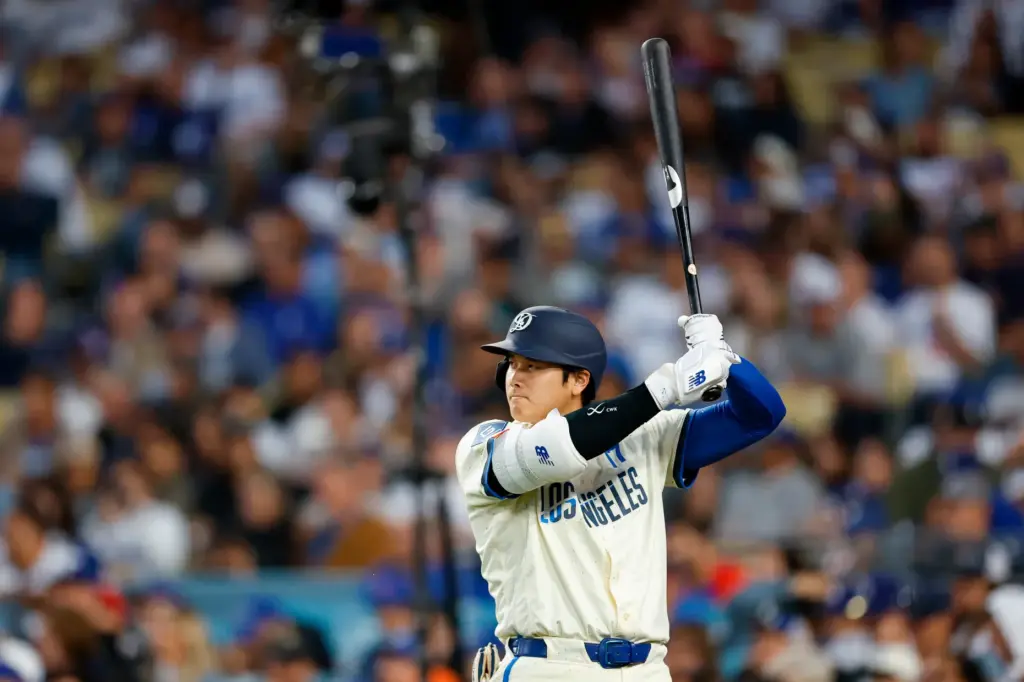 Dodgers designated hitter Shohei Ohtani (17) practices his swing while...
