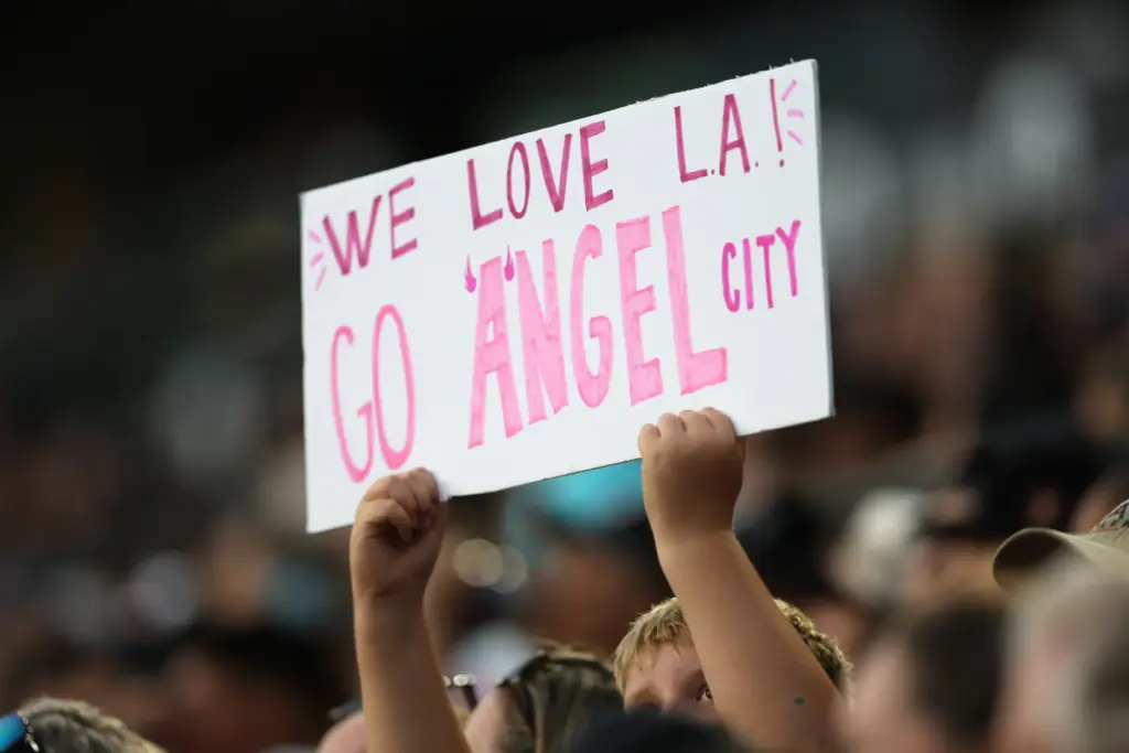 An Angel City FC fan holds up a sign during...