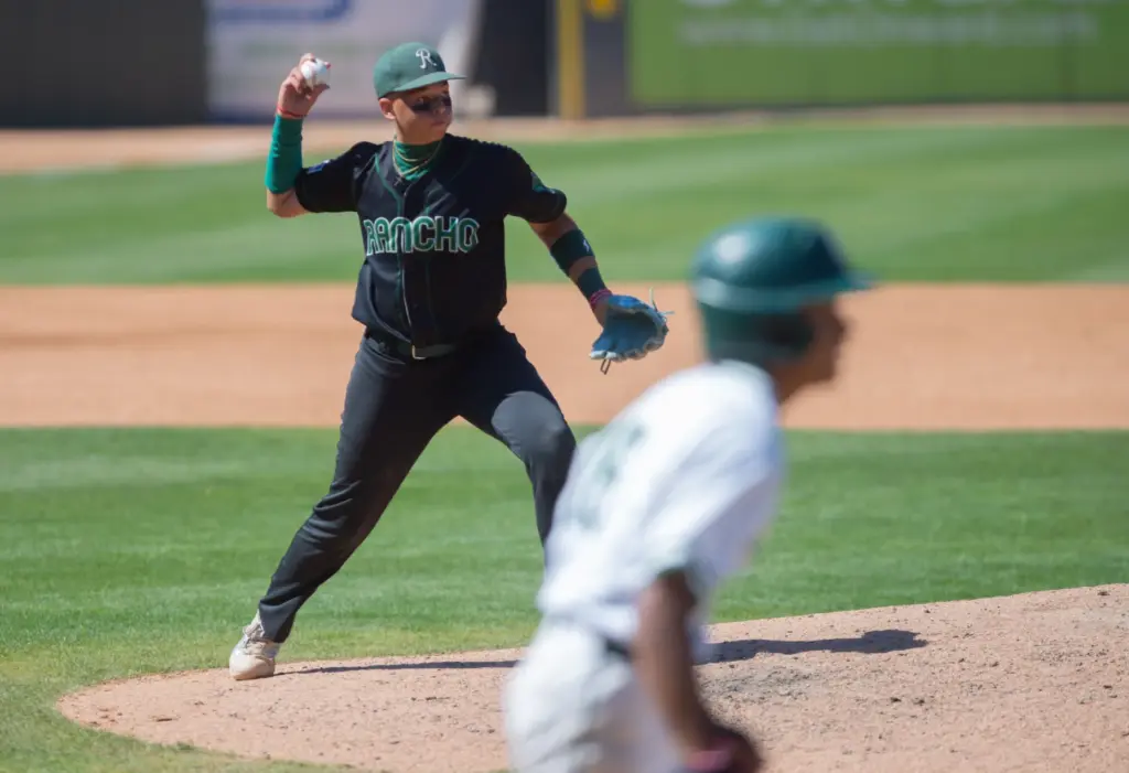 Rancho Alamitosâ Ethan Shepherd, (#2), fields the ball and throws...