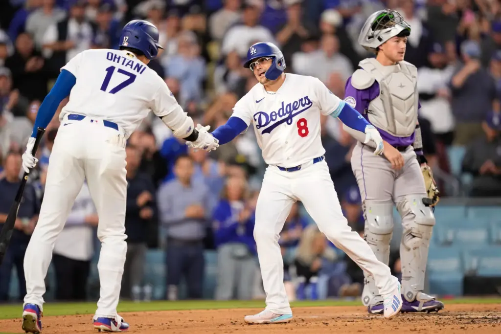 The Dodgers’ KikÃ© HernÃ¡ndez, center, is congratulated by Shohei Ohtani,...