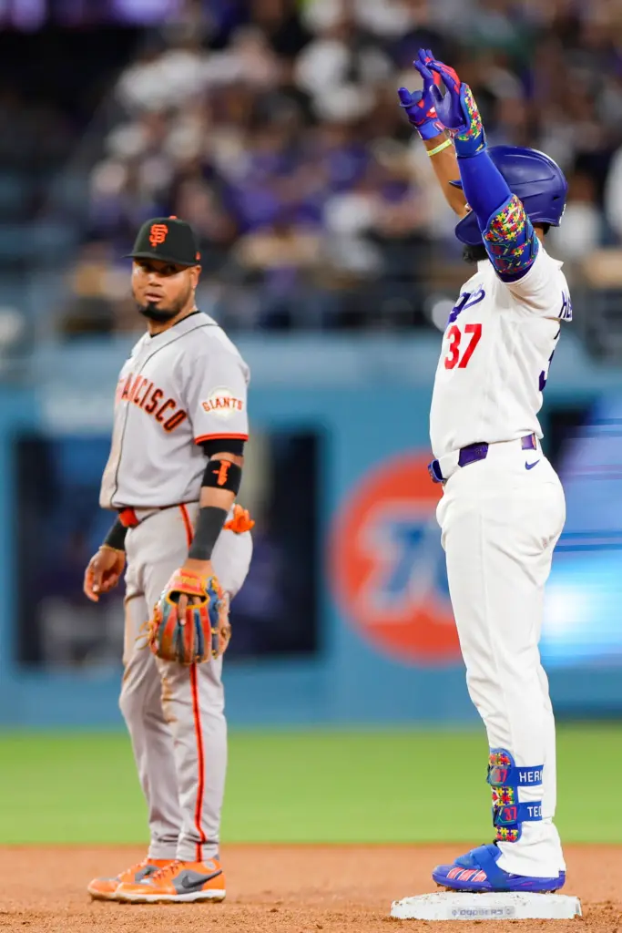 The Dodgers’ Teoscar Hernandez, right, celebrates next to San Francisco...