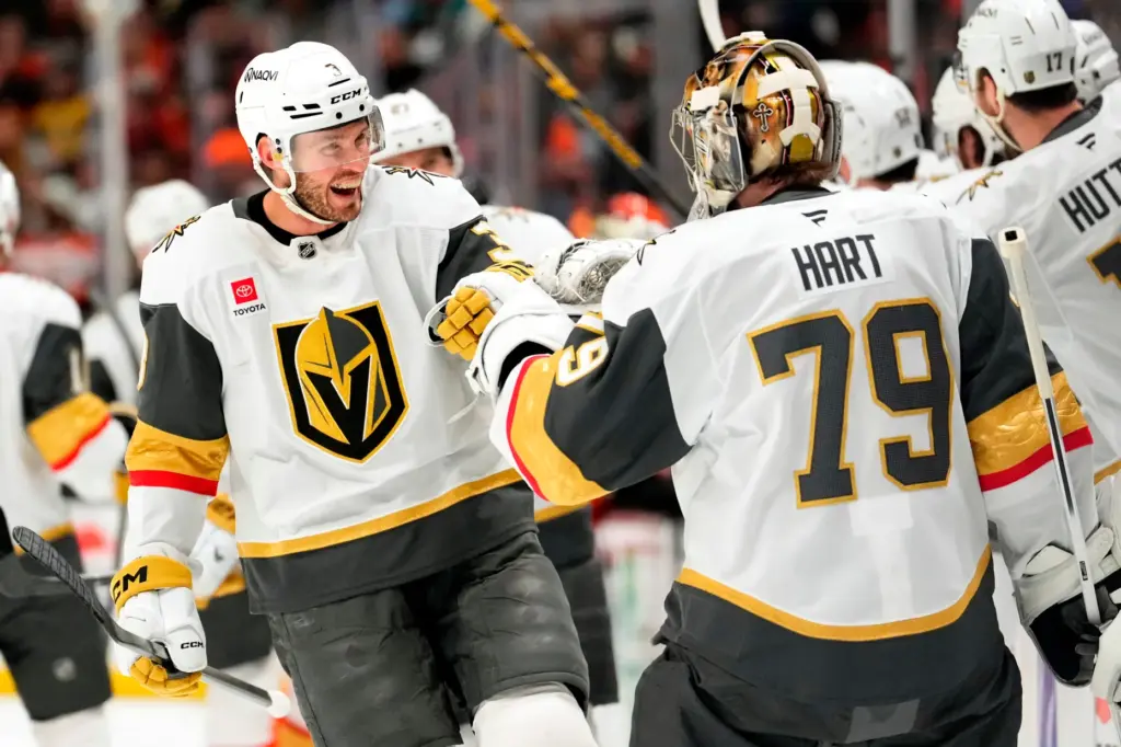 Vegas Golden Knights defenseman Brayden McNabb, left, celebrates his goal...