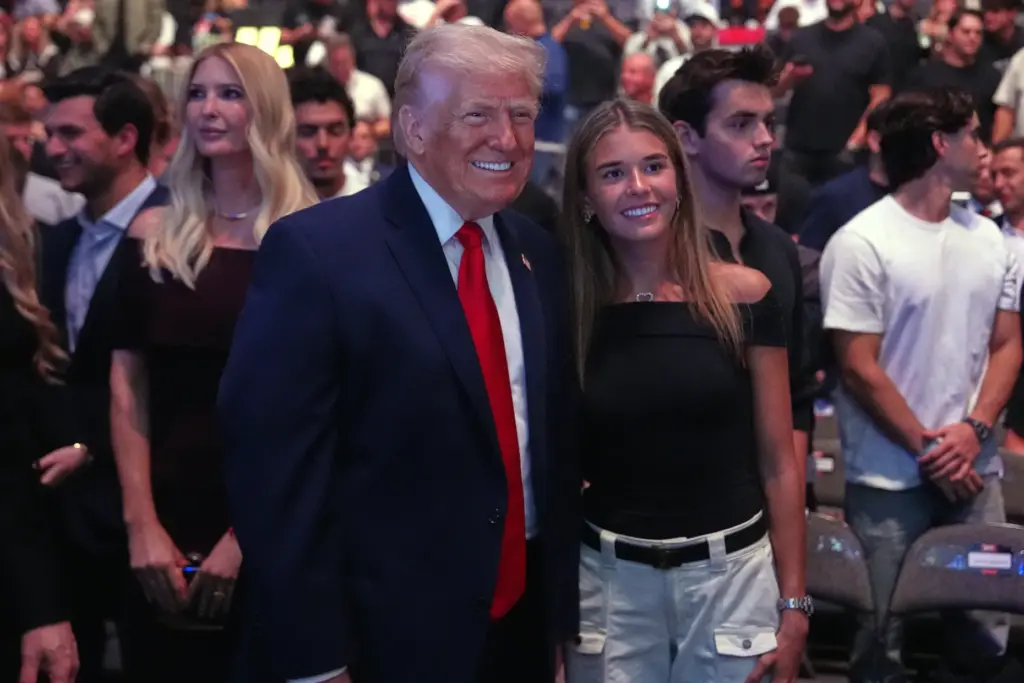 President Donald Trump stands with Kai Trump at the UFC...
