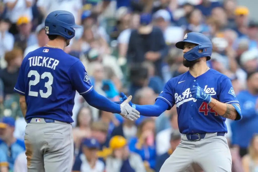 Dodgers’ Kyle Tucker (23) greets teammate Andy Pages (44) after...