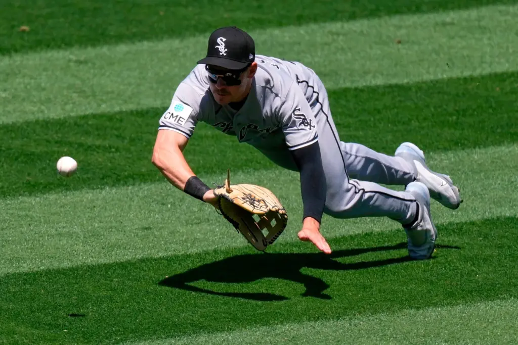 Chicago White Sox right fielder Jarred Kelenic can’t get to...