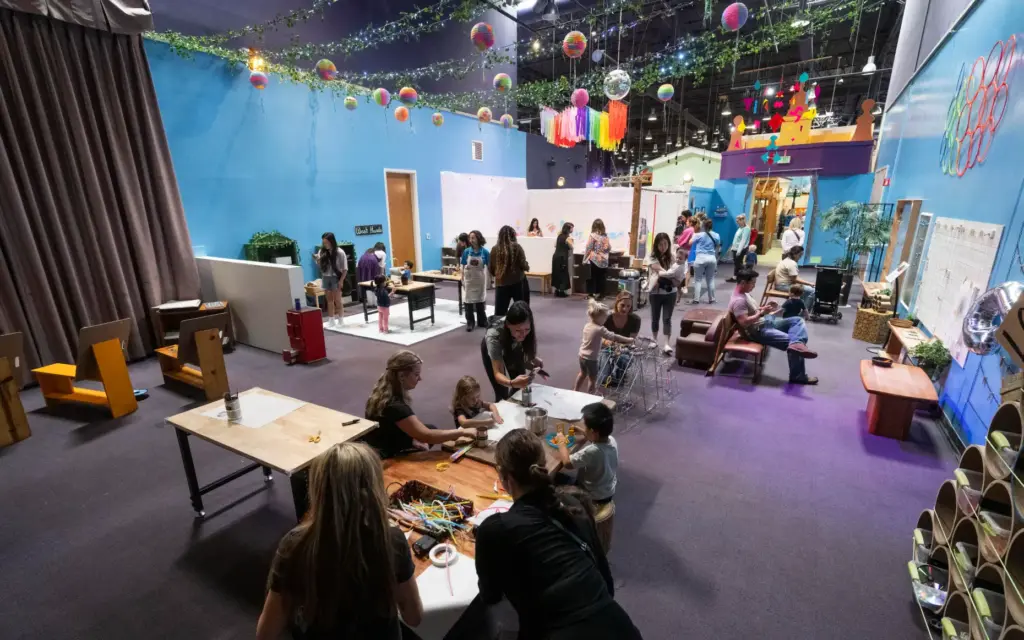 Kids and adults play at various stations during opening day...