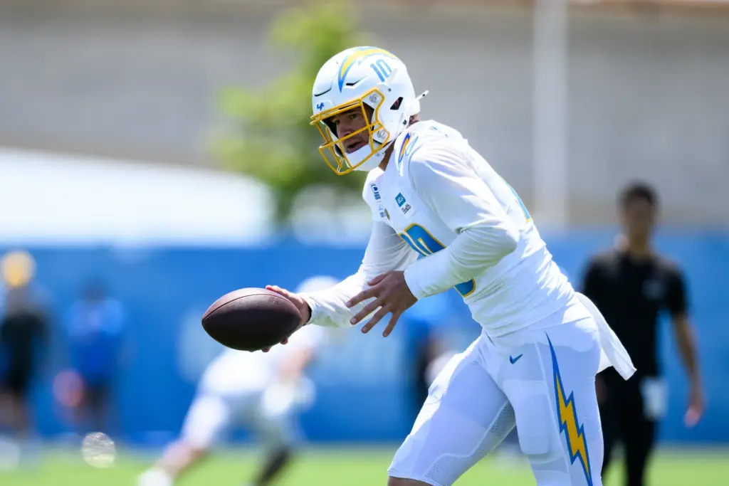 Chargers quarterback Justin Herbert runs a drill during the team’s...