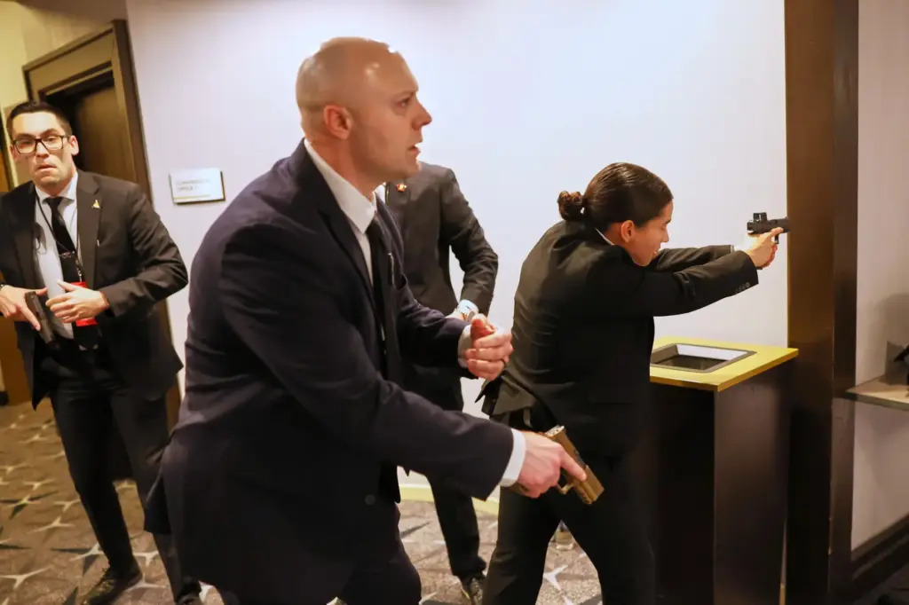 Members of law enforcement respond during the White House Correspondents' Dinner.