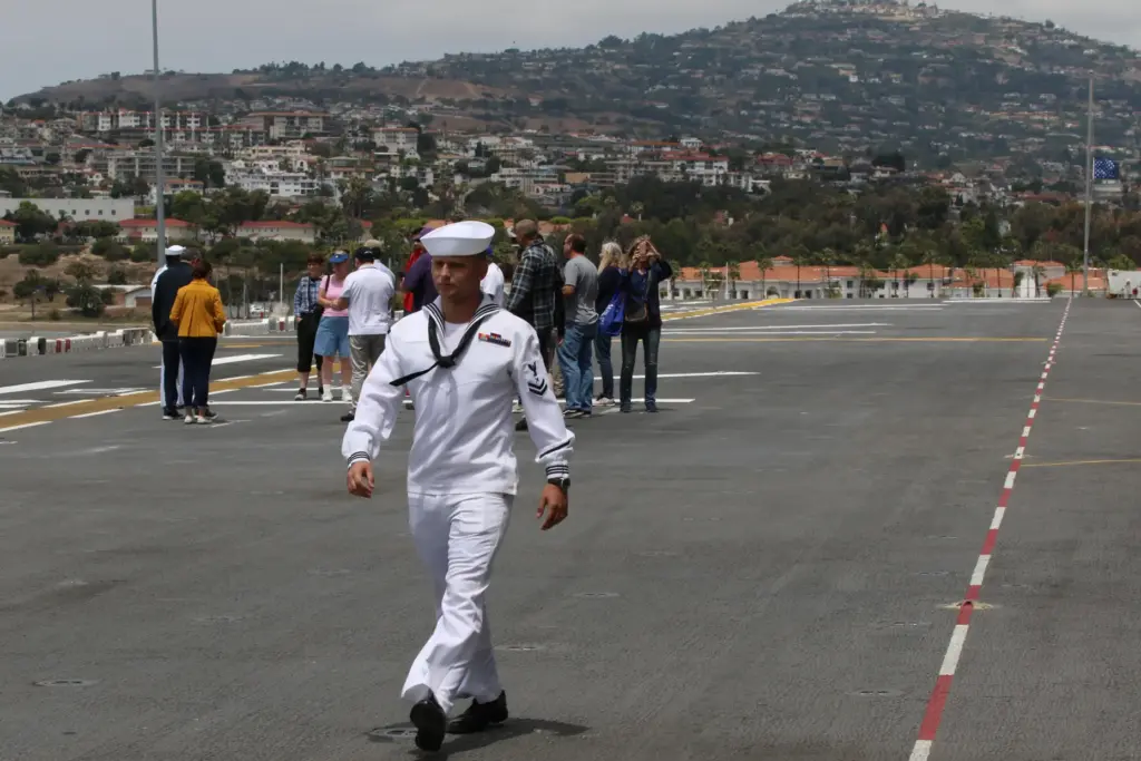 Navy cryptologic technician 2nd Class Jerame Goodman struts along the...