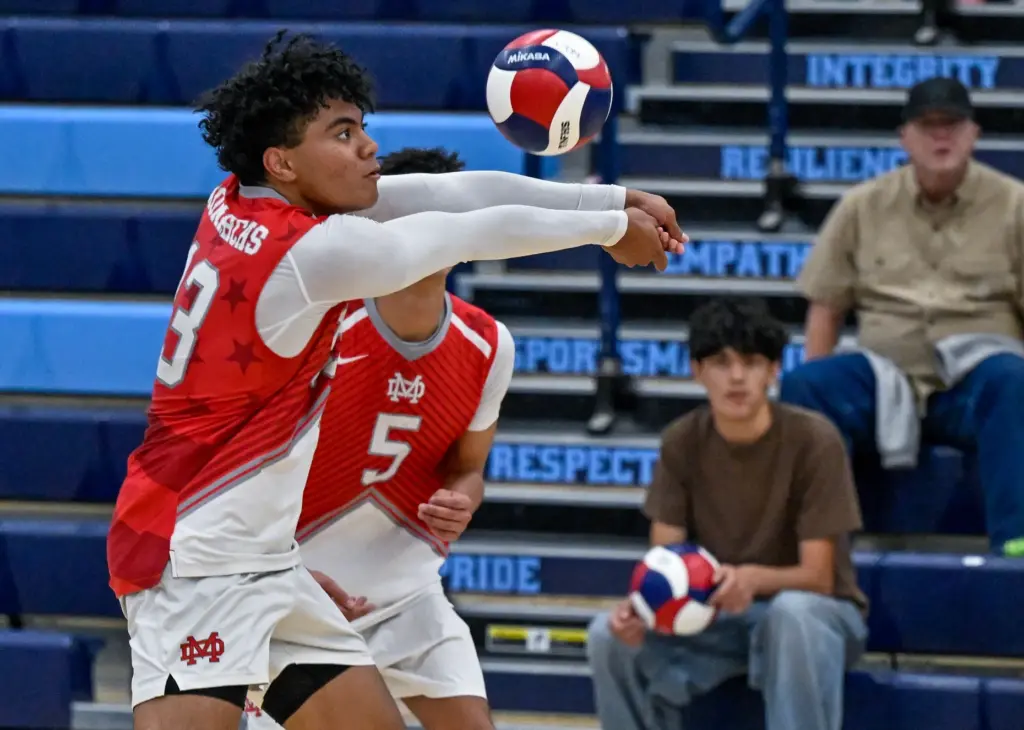 Mater Dei outside hitter Jeremiah Potasi digs the ball during...