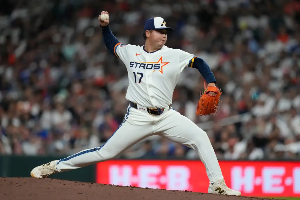 Houston Astros relief pitcher Kai-Wei Teng throws to the plate...