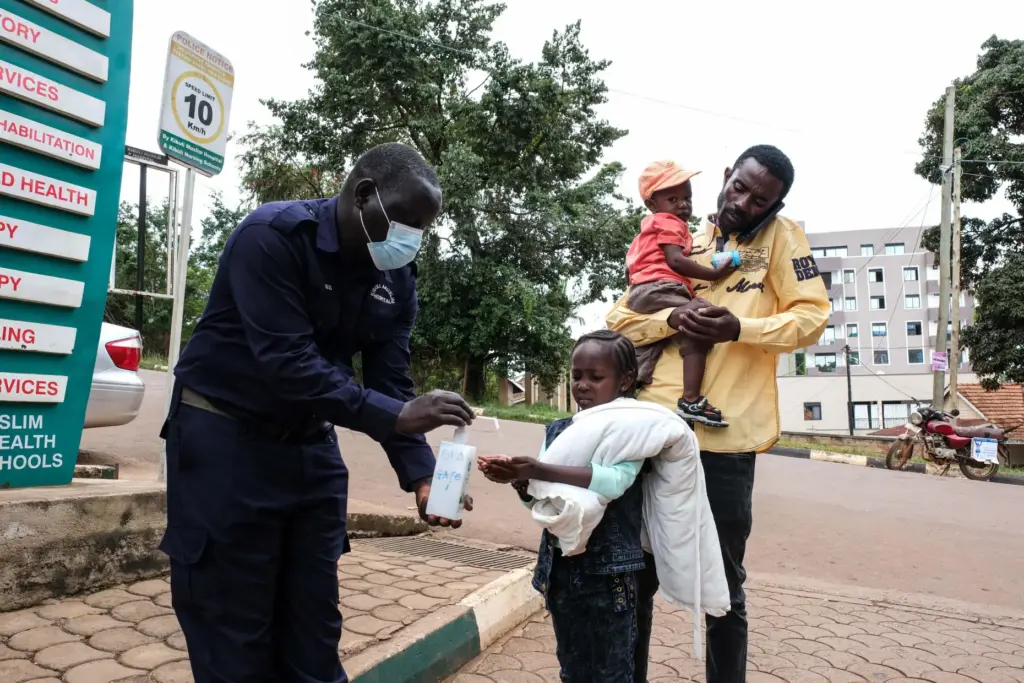 A girl sanitises her hands