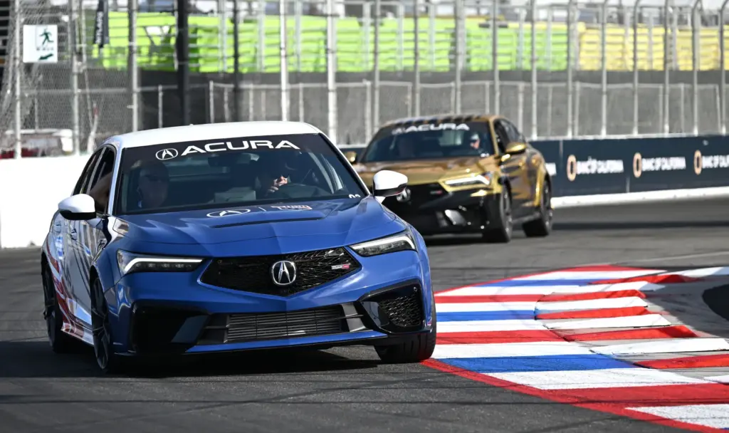 Race fans participate in the VIP track activities during the...