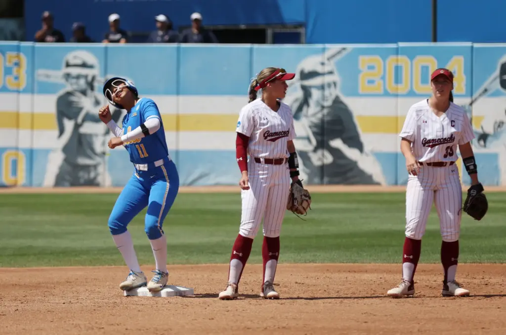 UCLAâs Soo-Jin Berry (11) celebrates after driving in two runs...
