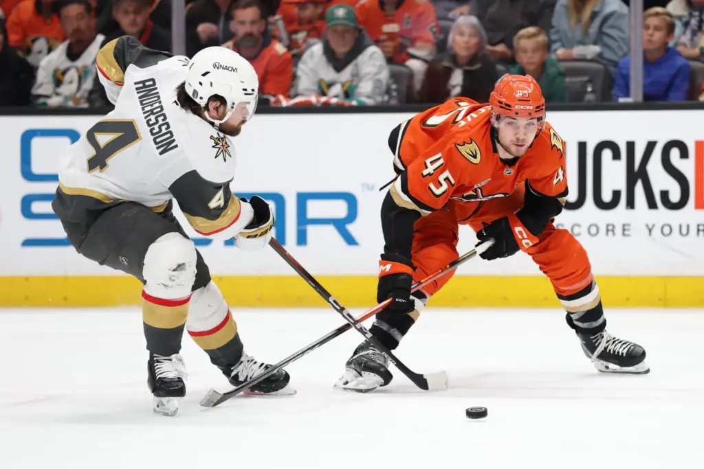 The Ducks’ Beckett Sennecke, right, and the Vegas Golden Knights’...