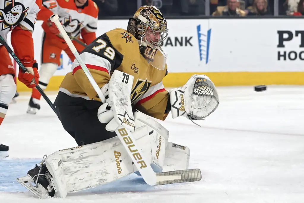 Vegas Golden Knights goaltender Carter Hart looks to catch a...