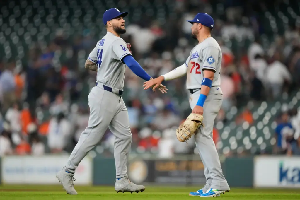 Dodgers center fielder Andy Pages, left, celebrates with teammate Miguel...