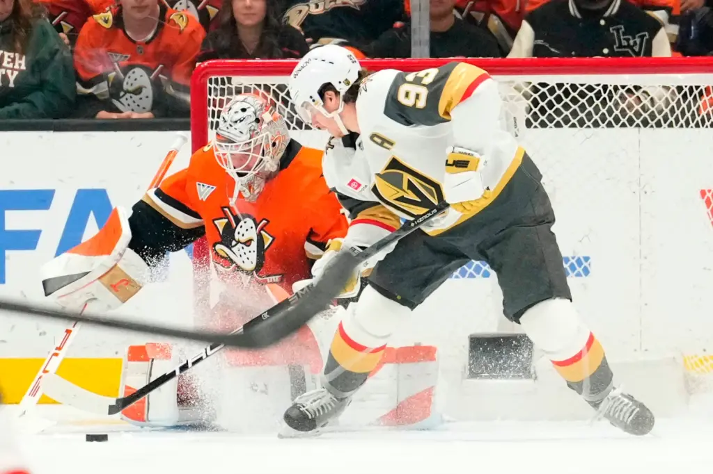 Vegas Golden Knights right wing Mitch Marner, right, gets set...