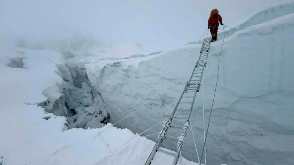 a mountaineer walks at Khumbu Icefall before beginning his ascent