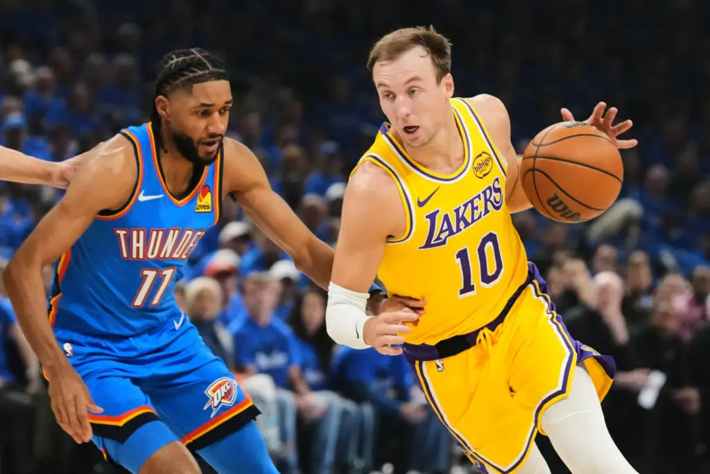 Lakers guard Luke Kennard drives as the Oklahoma City Thunder’s...