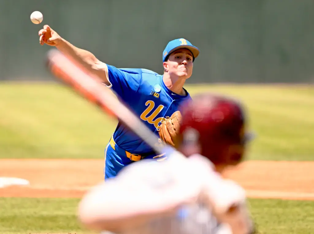 Starting pitcher Michael Barnett #55 of the UCLA Bruins throws...