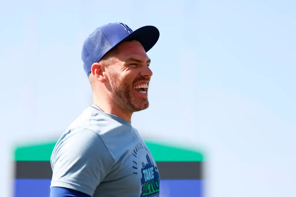Dodgers first baseman Freddie Freeman laughs on the field during...