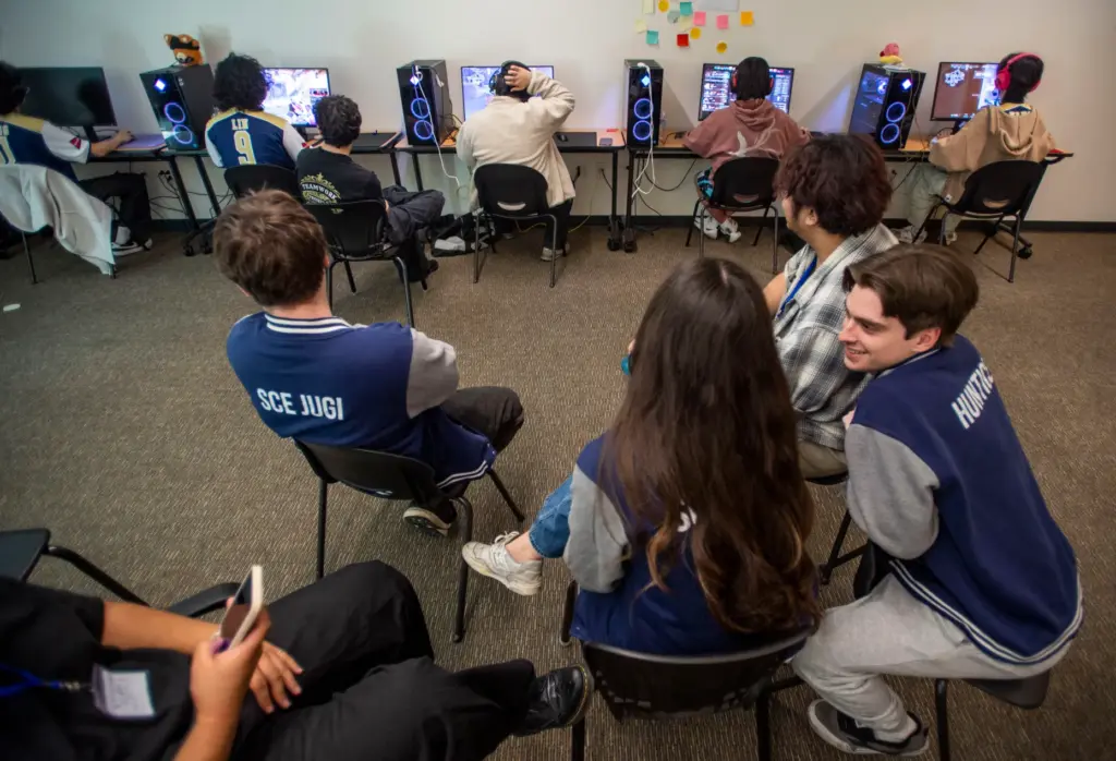 Members of the Santiago Canyon Collegeâs esports club monitor a...