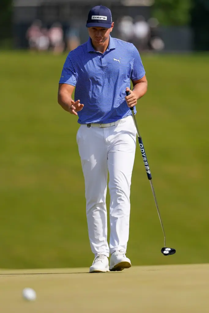 Matti Schmid, of Germany, follows his shot on the seventh...