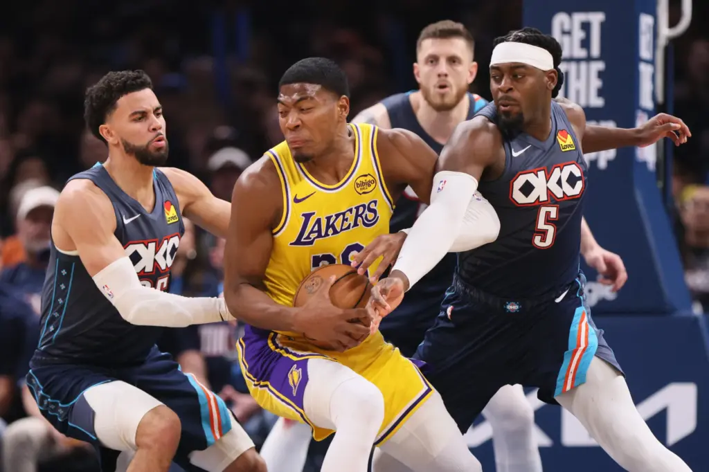 Oklahoma City Thunder’s Ajay Mitchell, left, and Luguentz Dort (5)...