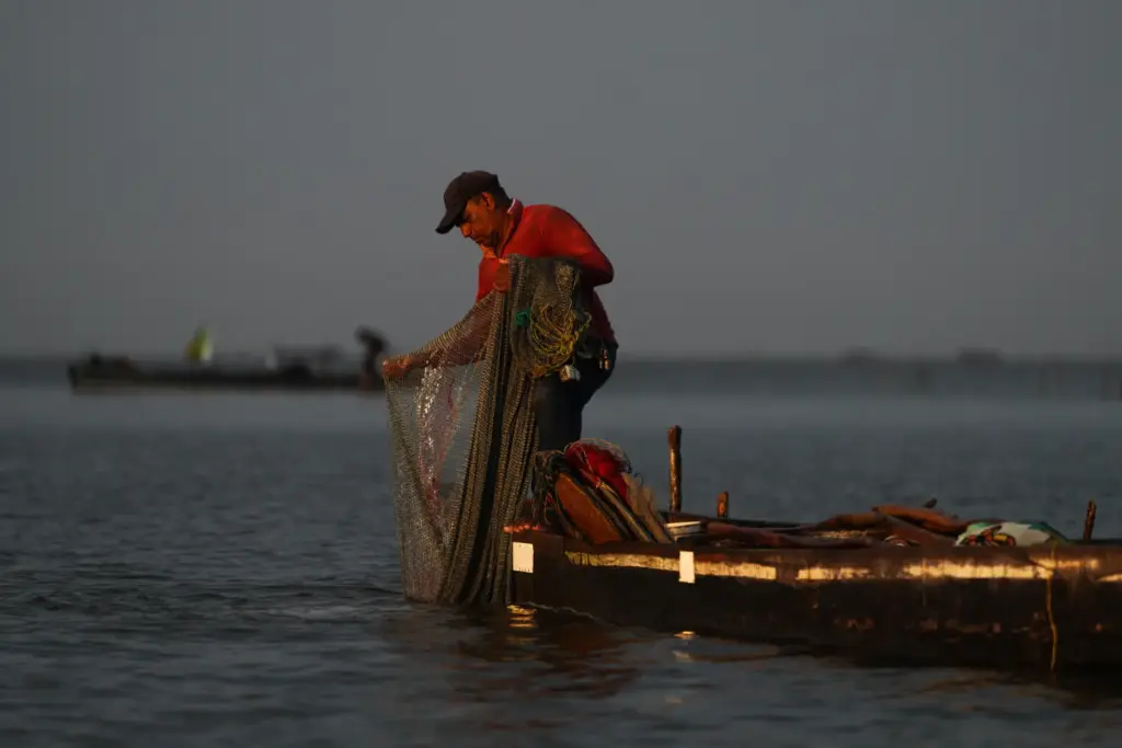 A fisher throws his net Thursday, April 30, 2026, on...