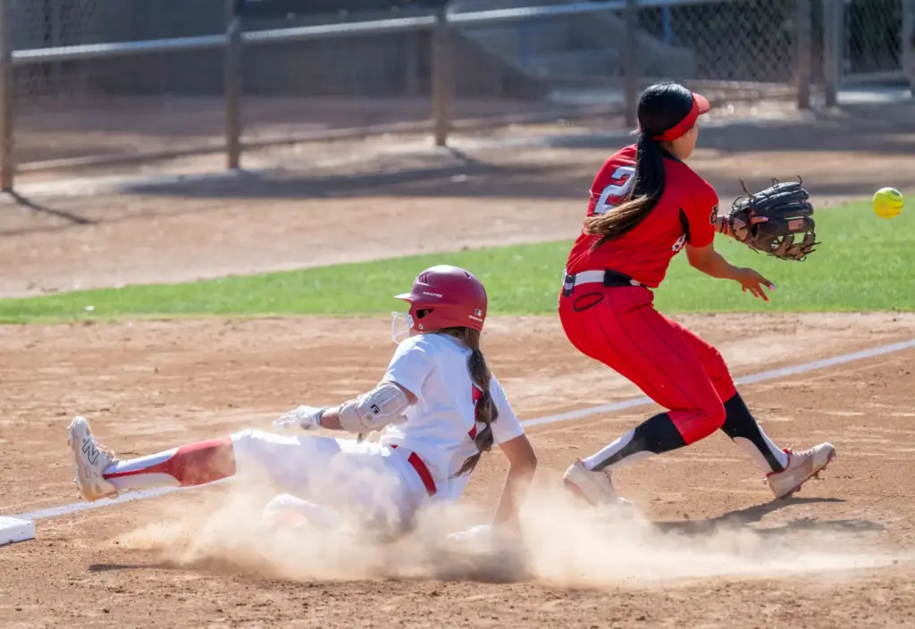 Mater Deiâs Danica Lancelotti slides safely into third base, avoiding...