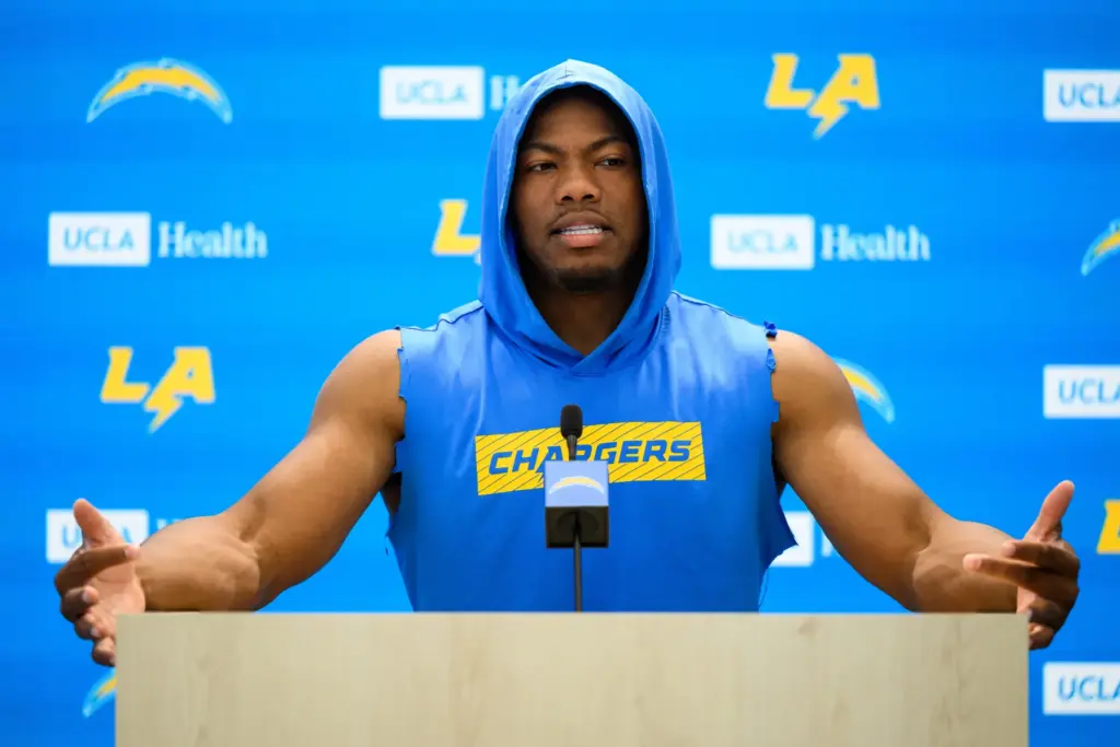 Chargers linebacker Daiyan Henley speaks to reporters after the team’s...