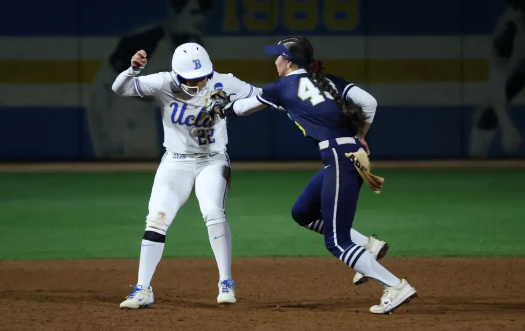 UCLAâs Bri Alejandre, left, tries to avoid being tagged by...
