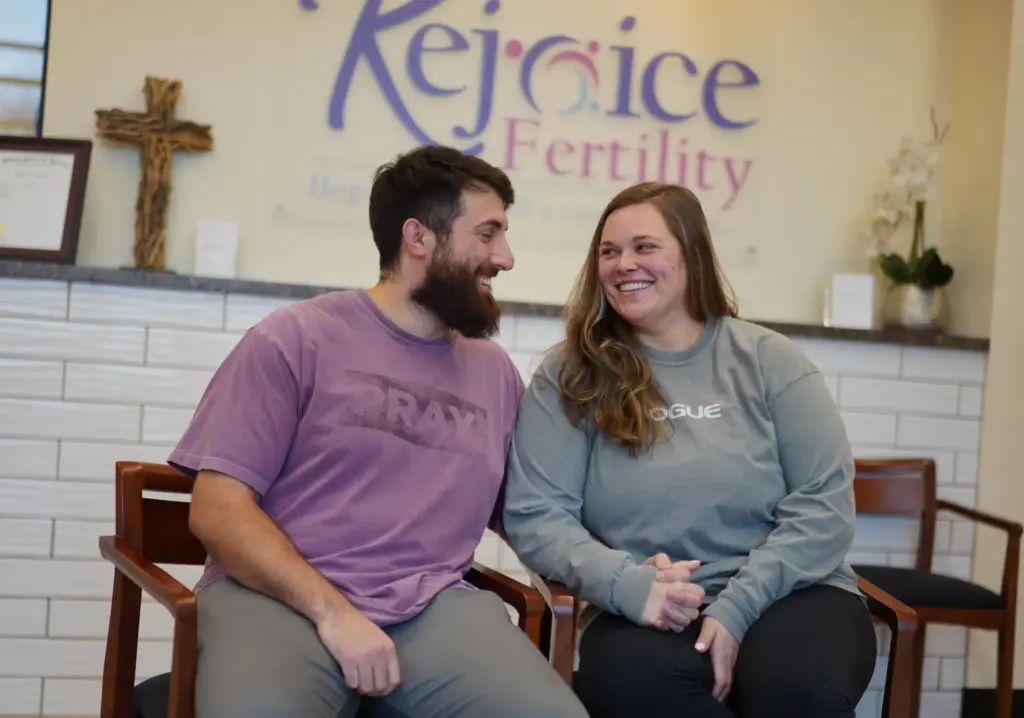 IVF patients Domenic and Olivia D'Agostino sit for a portrait at Rejoice Fertility.