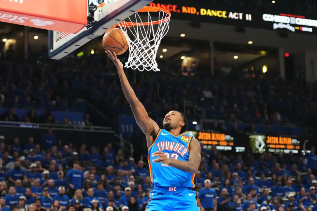 Oklahoma City Thunder guard Cason Wallace gets to the basket...
