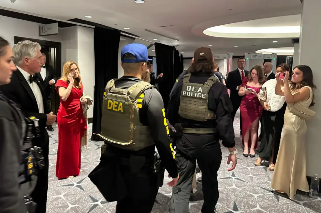 Members of law enforcement respond after a shooting incident outside...