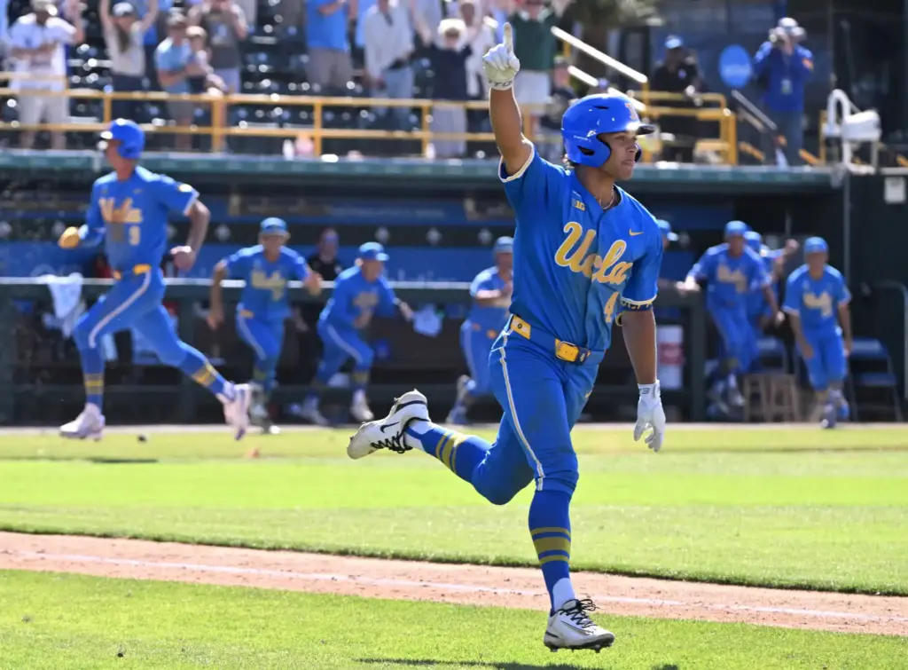 Phoenix Call #4 of the UCLA Bruins reacts after hitting...