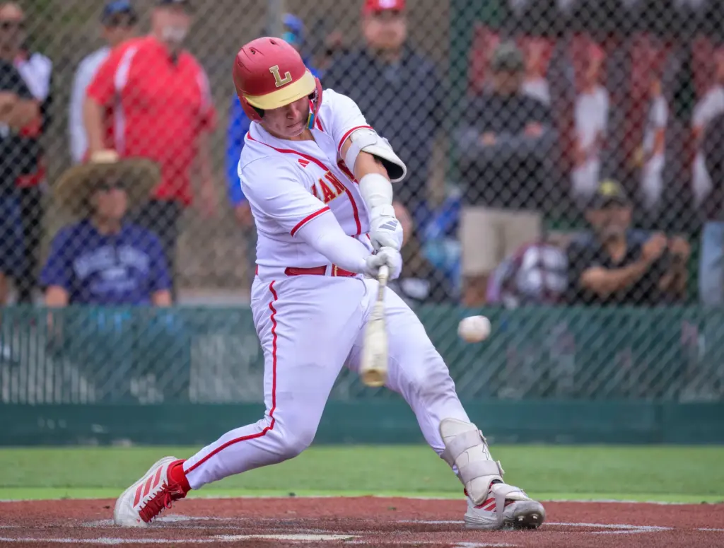 Orange Lutheran catcher Brady Murrietta connects for an extra base...