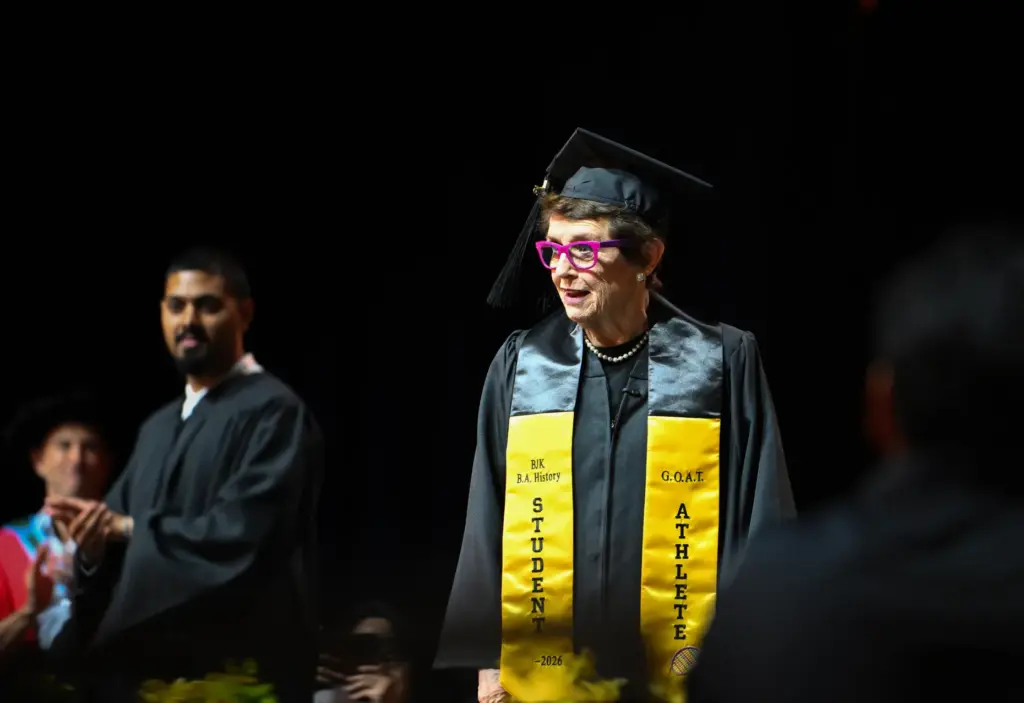 Billie Jean King walks the stage as she receives her...