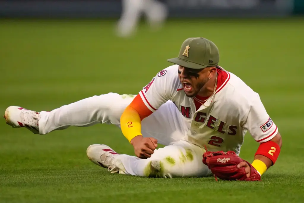 Angels second baseman Oswald Peraza celebrates after throwing out the...