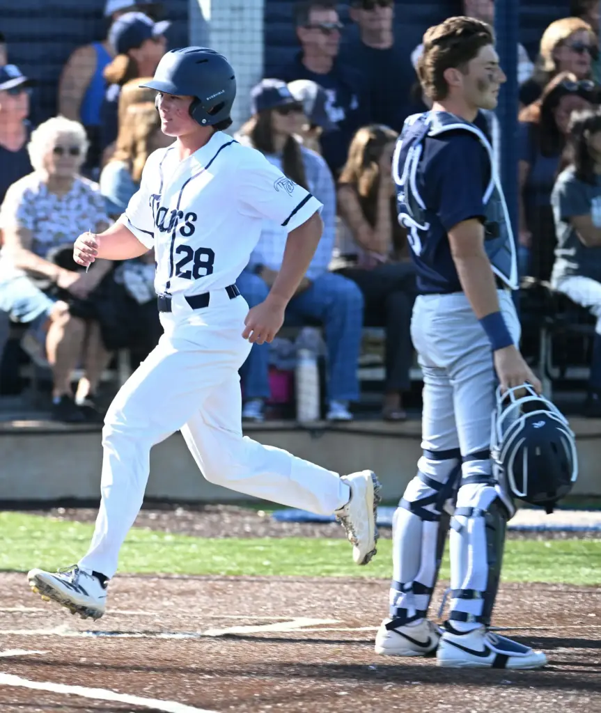 #28 of Newport Harbor scores in the 5th inning against...