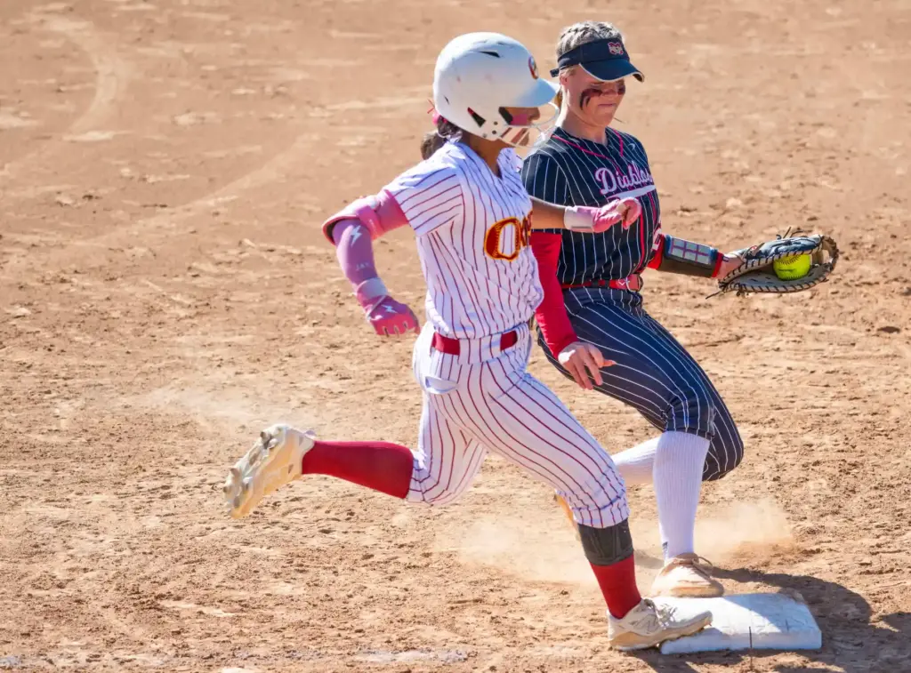 Mission Viejo first baseman Kylee Jepson, right, beats Oxnardâs Jaylene...