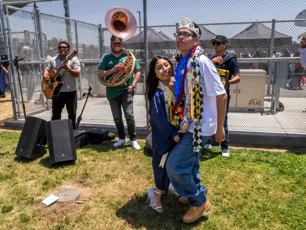 Graduate Britney Rosas and Manny PiÃ±eda dance to the music...