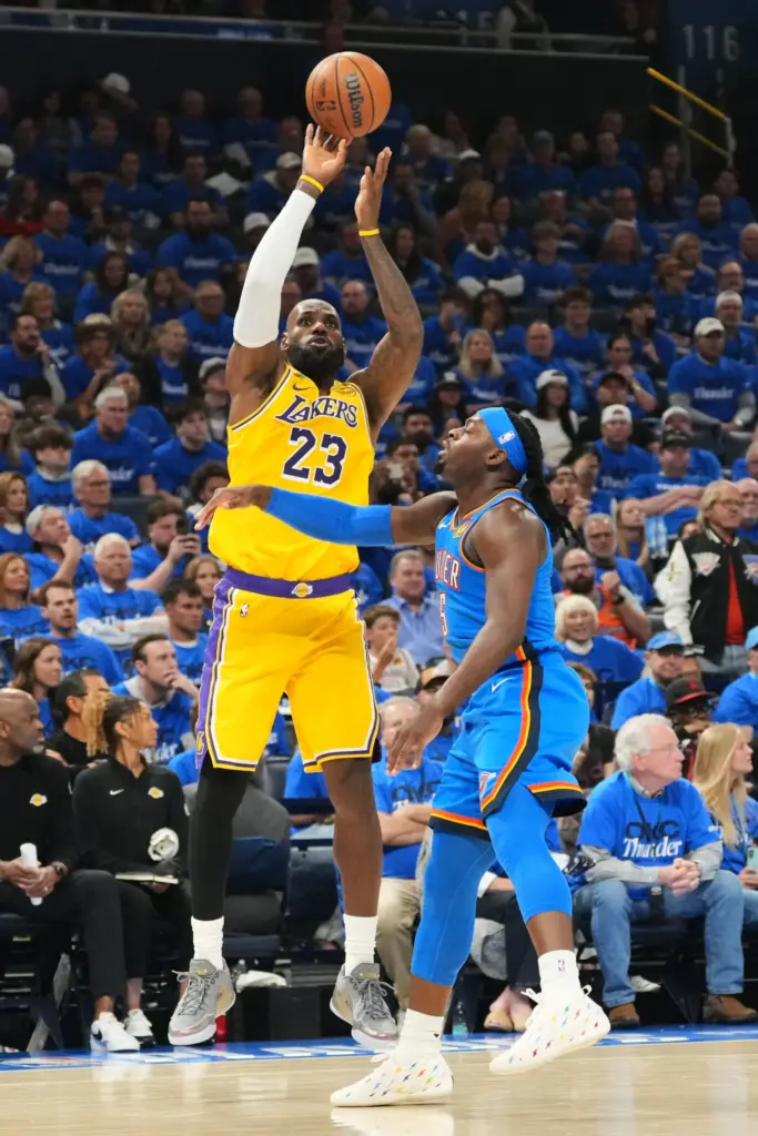 Lakers forward LeBron James shoots over Oklahoma City Thunder guard...