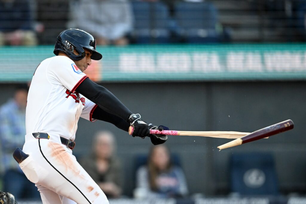 The Cleveland Guardians’ Brayan Rocchio breaks his bat as he...