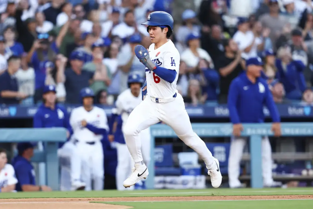 The Dodgers’ Hyeseong Kim runs to score off an RBI...