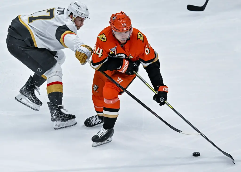 The Ducksâ Mikael Granlund (64) controls the puck during the...