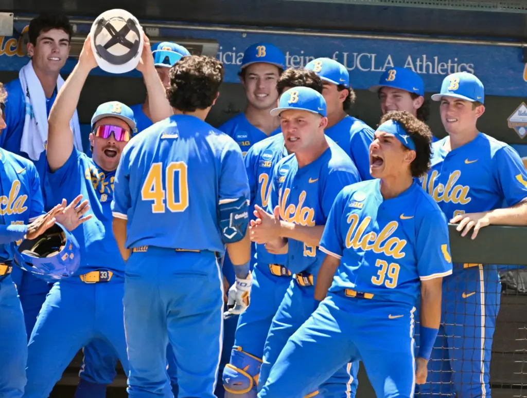 Cashel Dugger #40 of the UCLA Bruins celebrates with teammates...