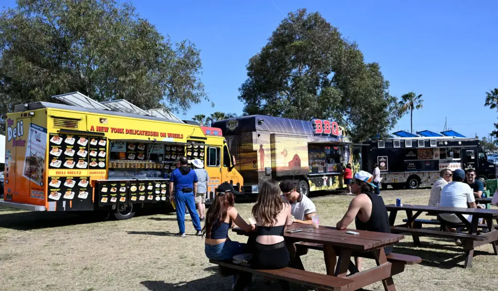 Race fans relax at the food trucks during the 51st...