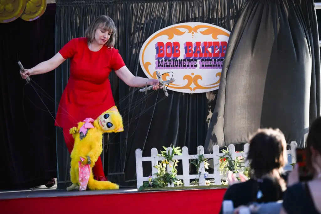 A puppeteer with the Bob Baker Marionette Theater performs for...